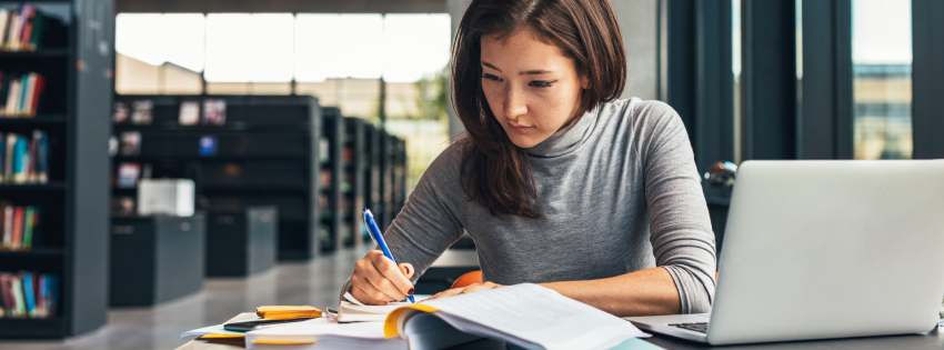 Woman studying in a library