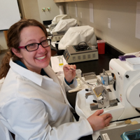 student working with microscope