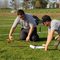 students working on landscaping irrigation